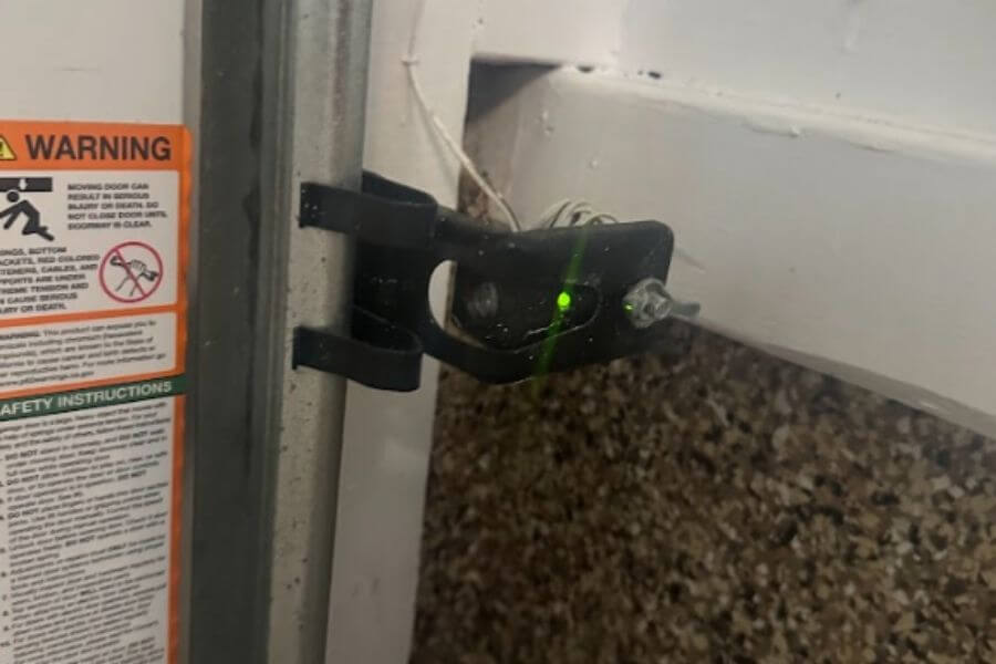 why is my garage door sensor light turning off and on Why Is My Garage Door Sensor Light Turning Off and On?